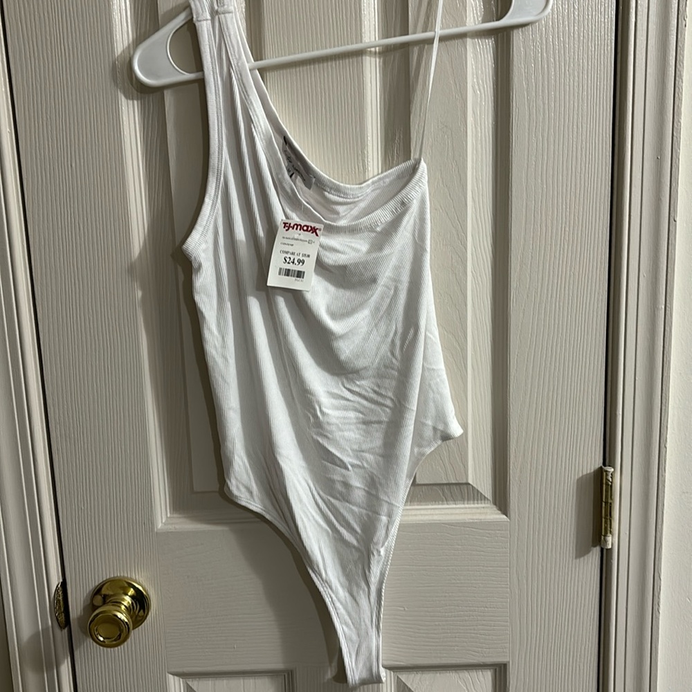 2 one shoulder body suits tan and white